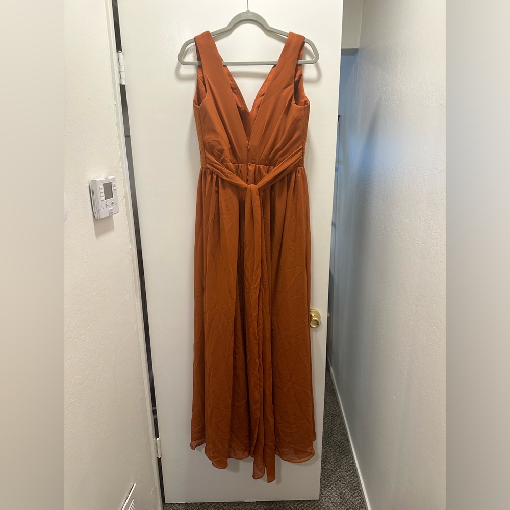 Women’s v-neck, pleated chiffon dress